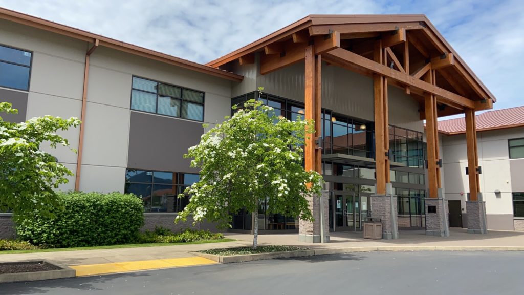 Photo of the front of the Main Campus Building in Spring