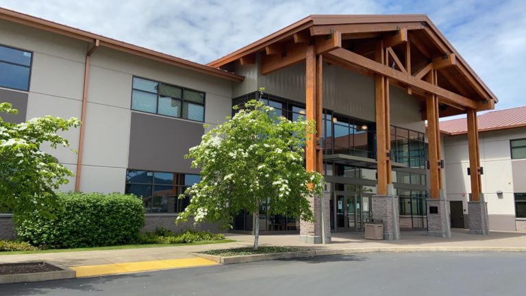Photo of the front of the Main Campus Building in Spring