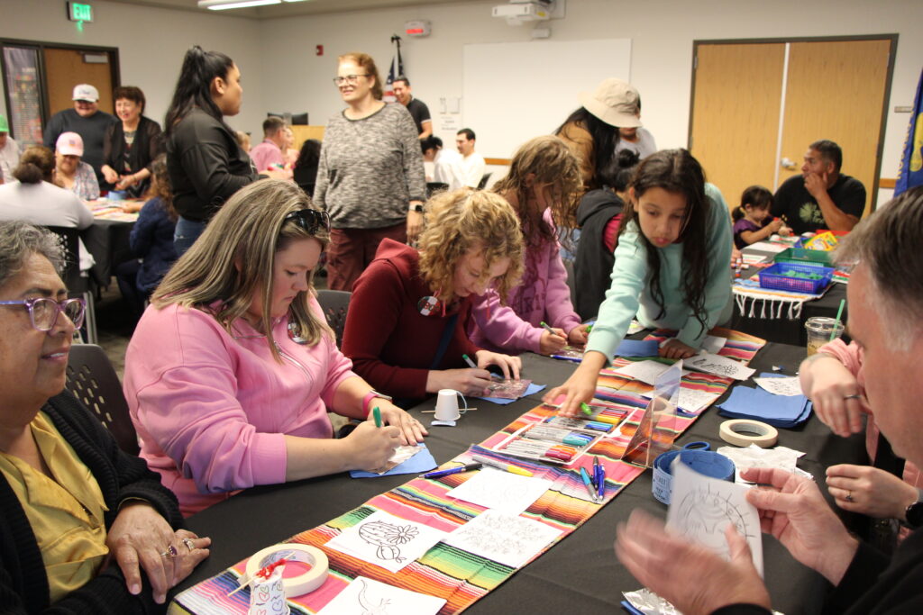 Community members doing arts and crafts